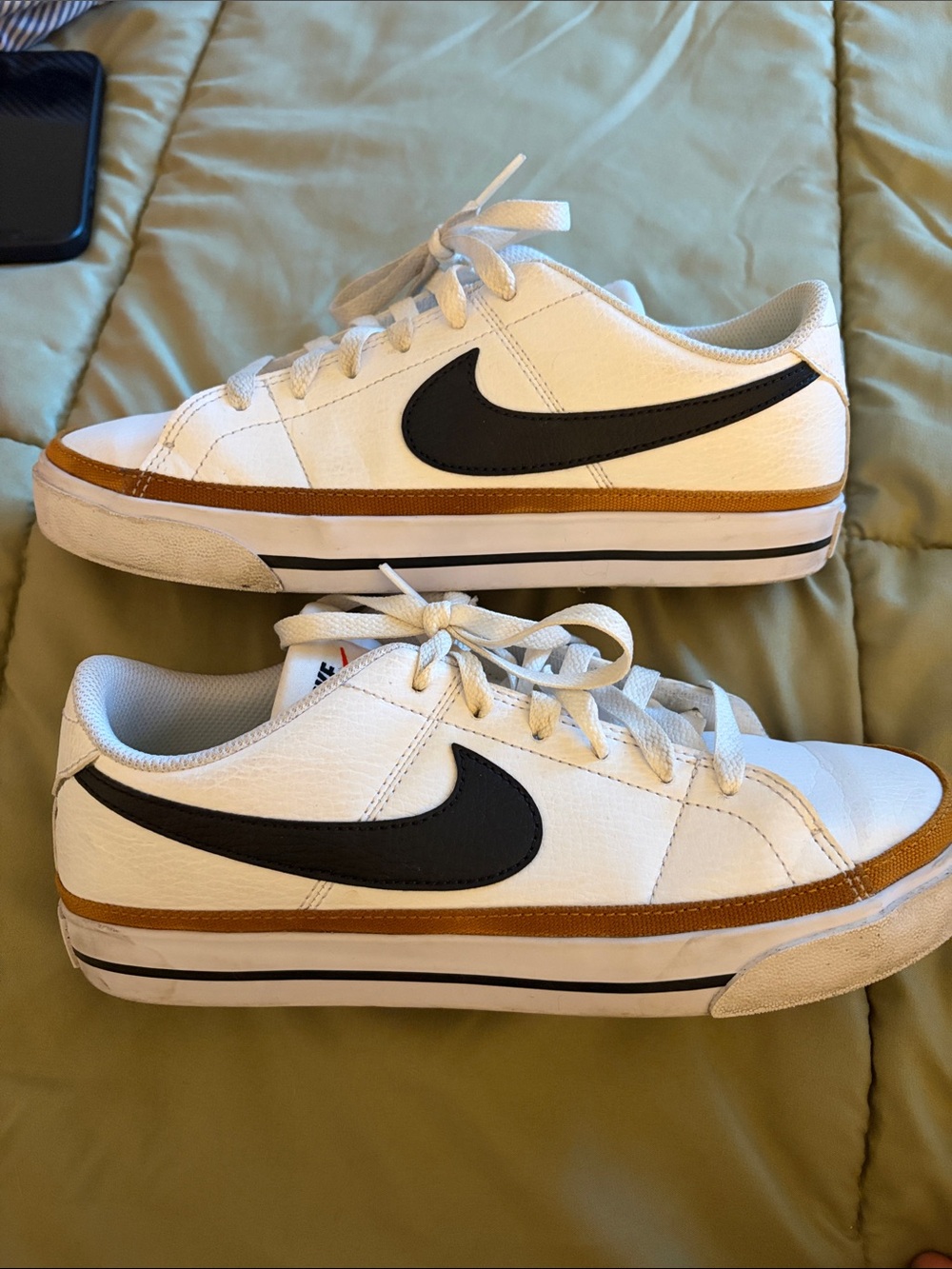 Nike White Low-Top Sneakers with Black Swoosh and Brown Trim